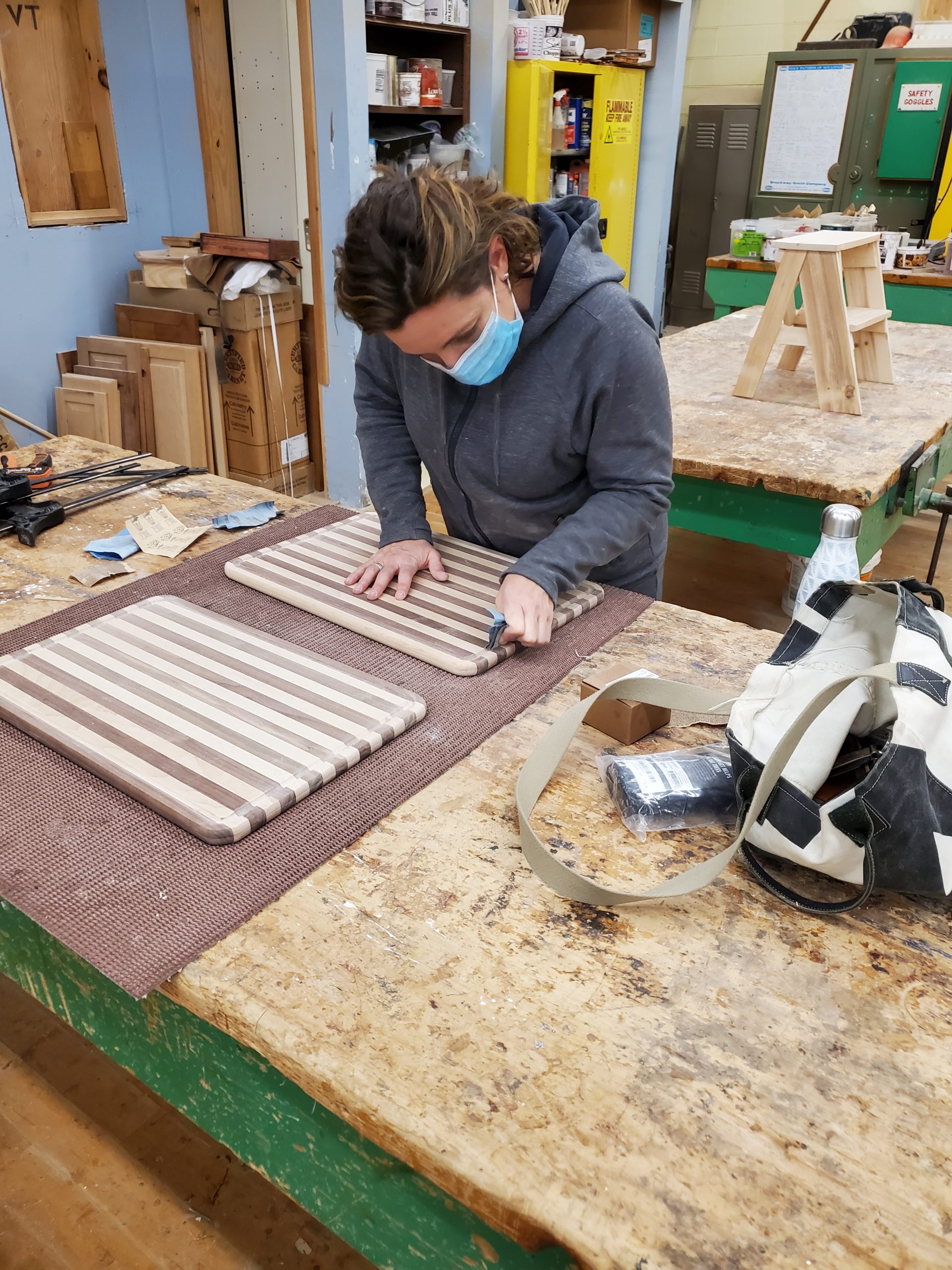 fine woodworking class woman works on duplicating a cutting board