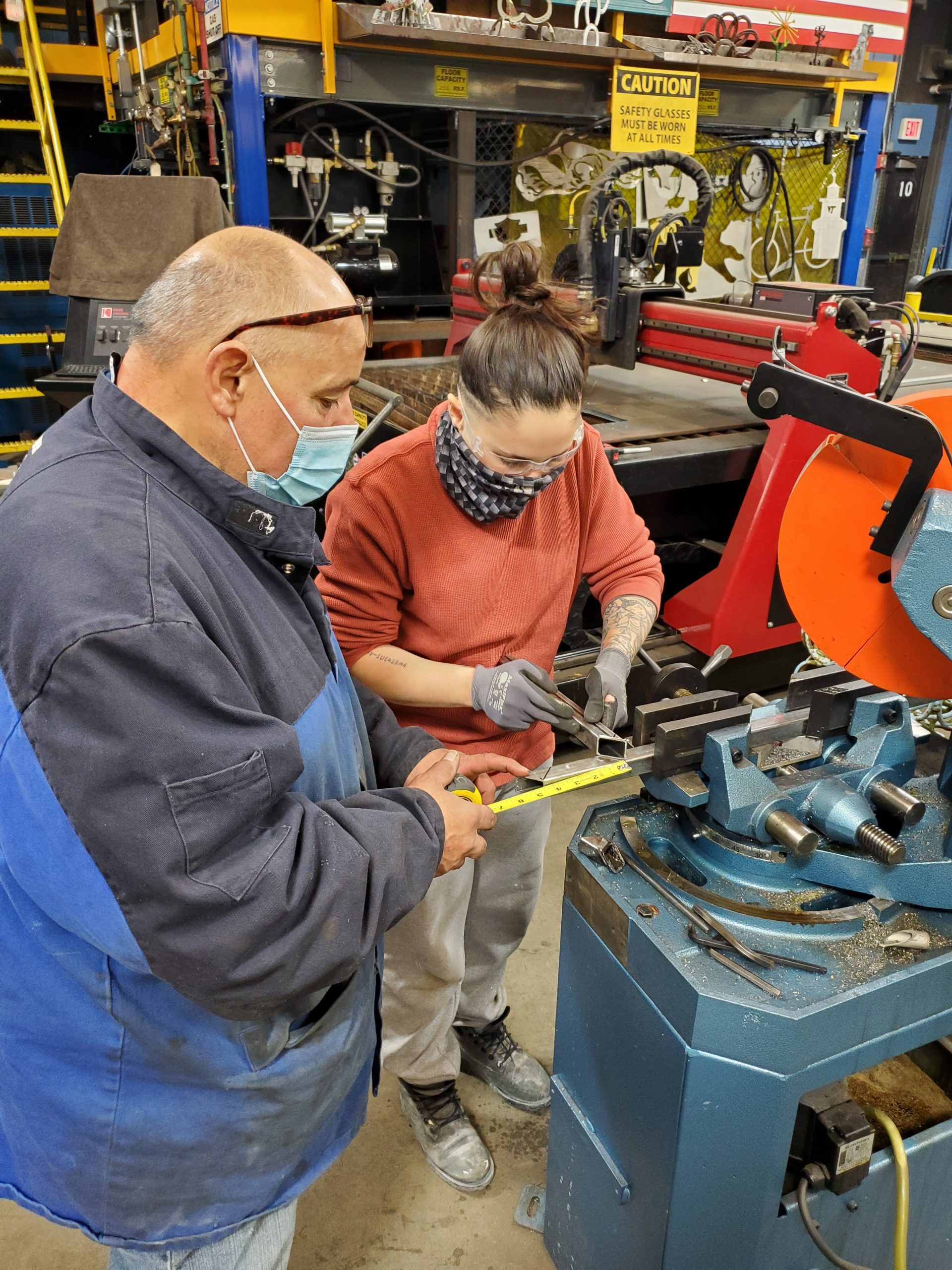 Mig Tig Welding Class student works with instructor on equipment