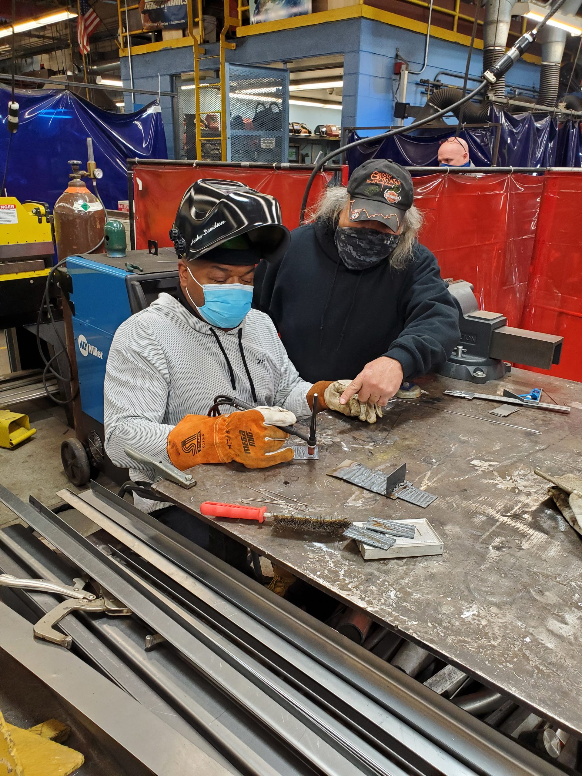 Mig Tig Welding Class student works with instructor on a project